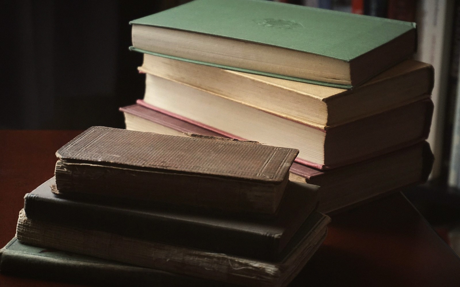 a stack of novels on a table
